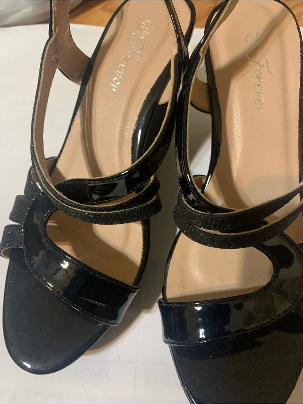 Forever Women’s glitter strappy wrapped ankle wedge sandals.